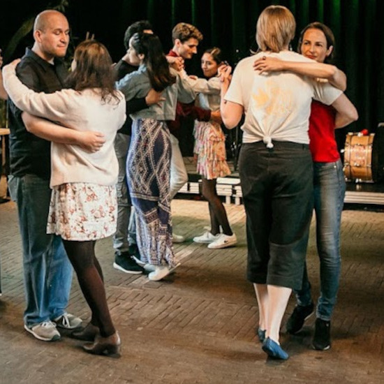 Forró Nacht party with people dancing North Eastern Brazilian dances.